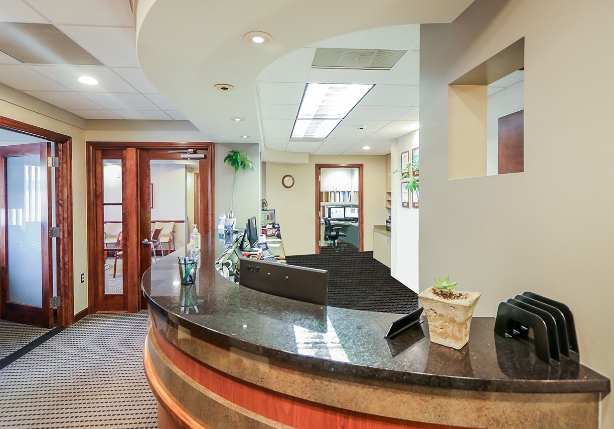 a room filled with furniture and a large window