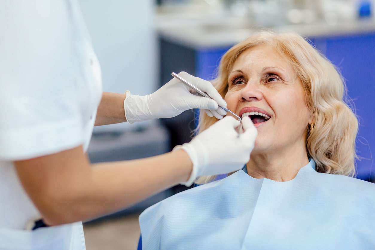 Dentist cleaning a patient's teeth