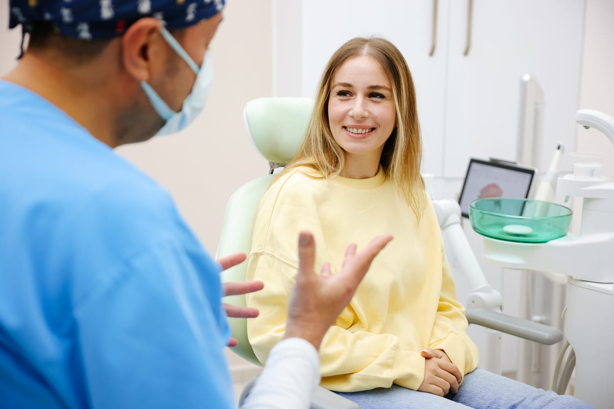 Woman speaking with her dentist