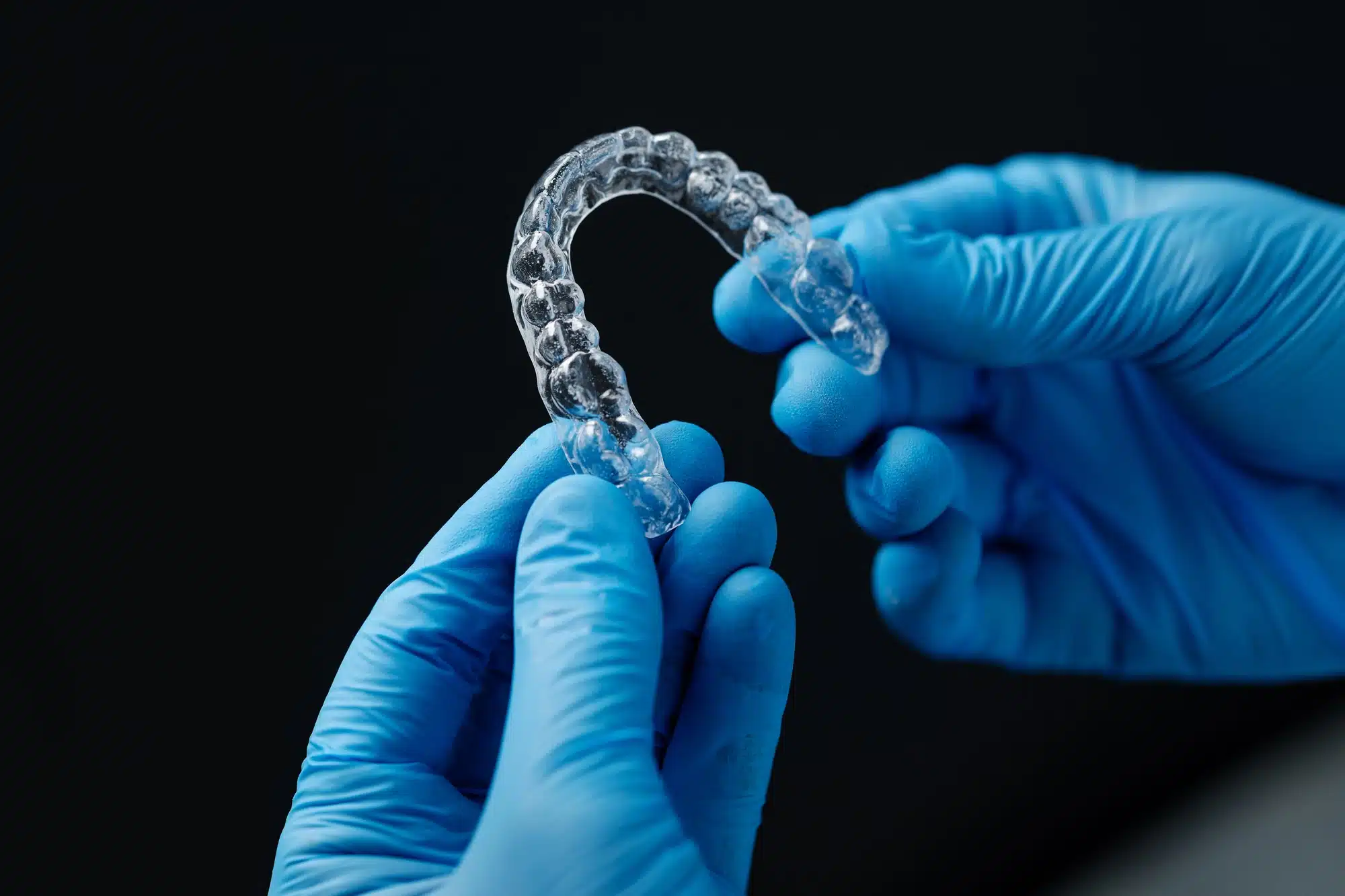 dentist holding invisalign detroit