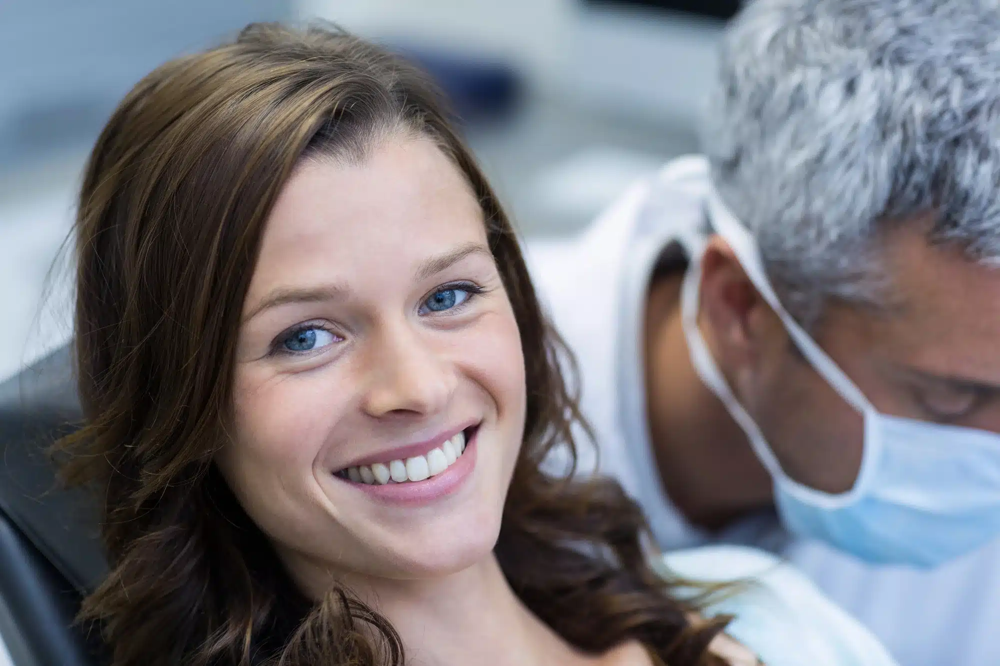 woman smiling during a visit to dentist in novi mi