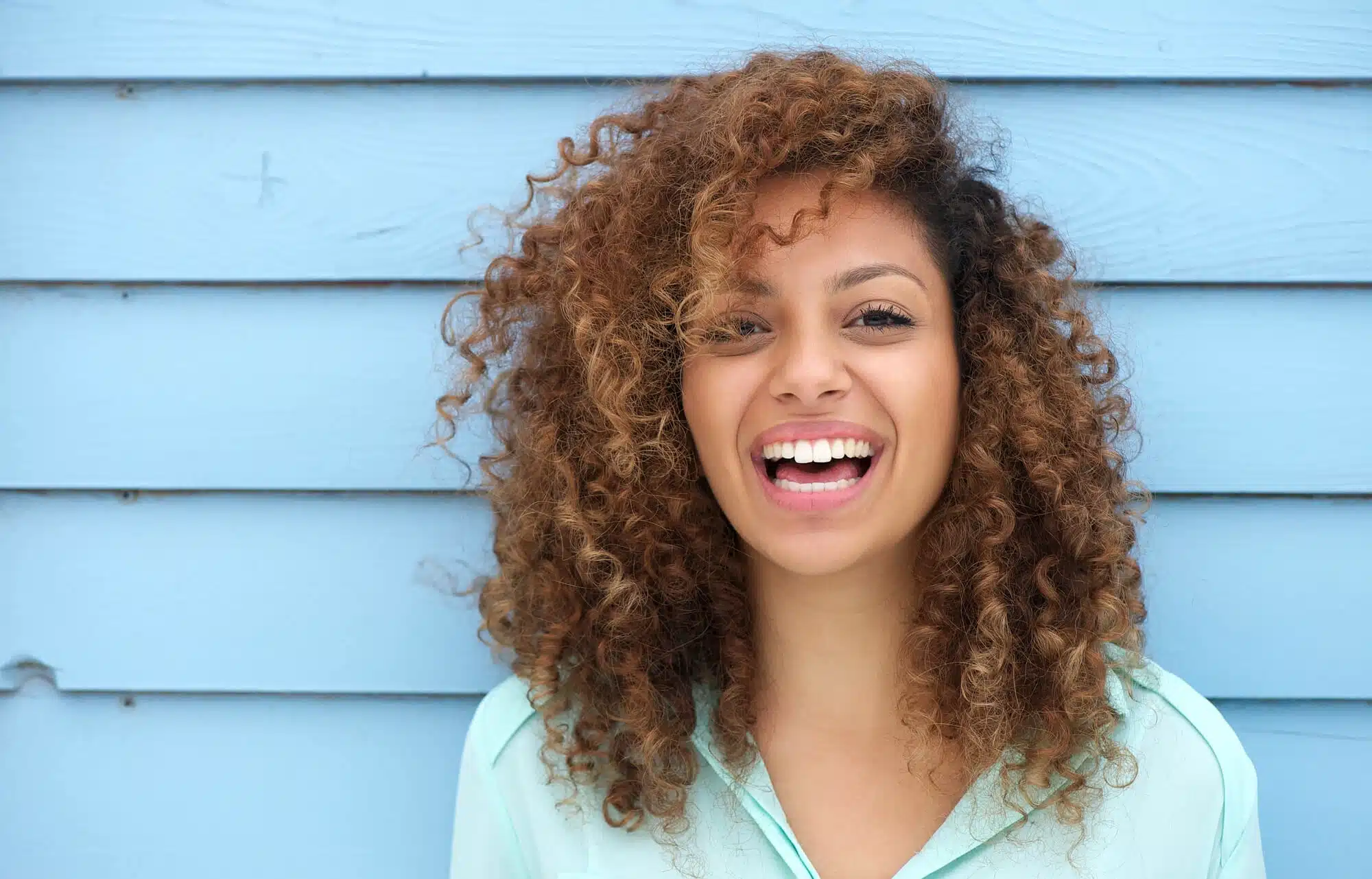 Woman smiling after dental bonding detroit