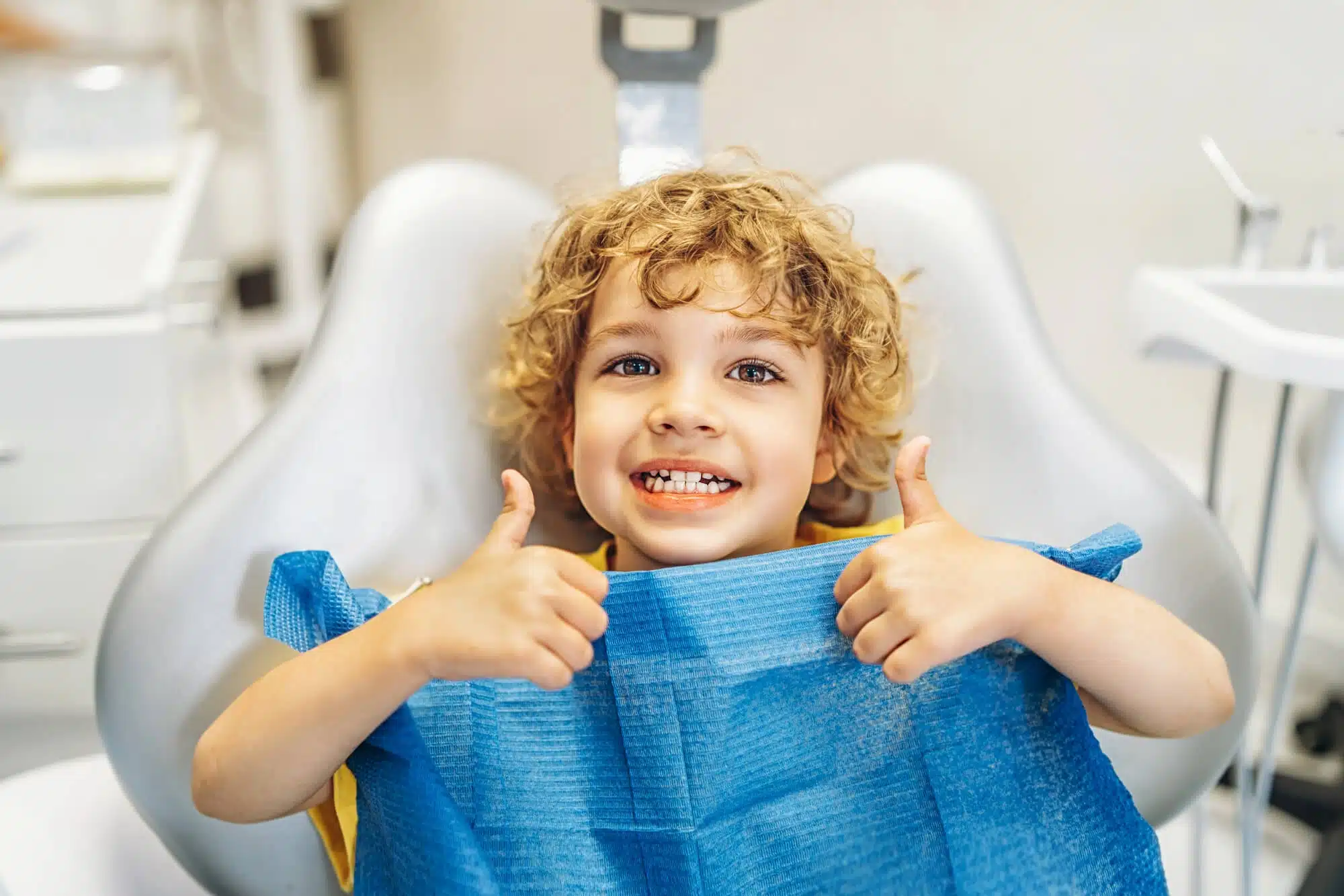 Kid smiling at dentist novi mi
